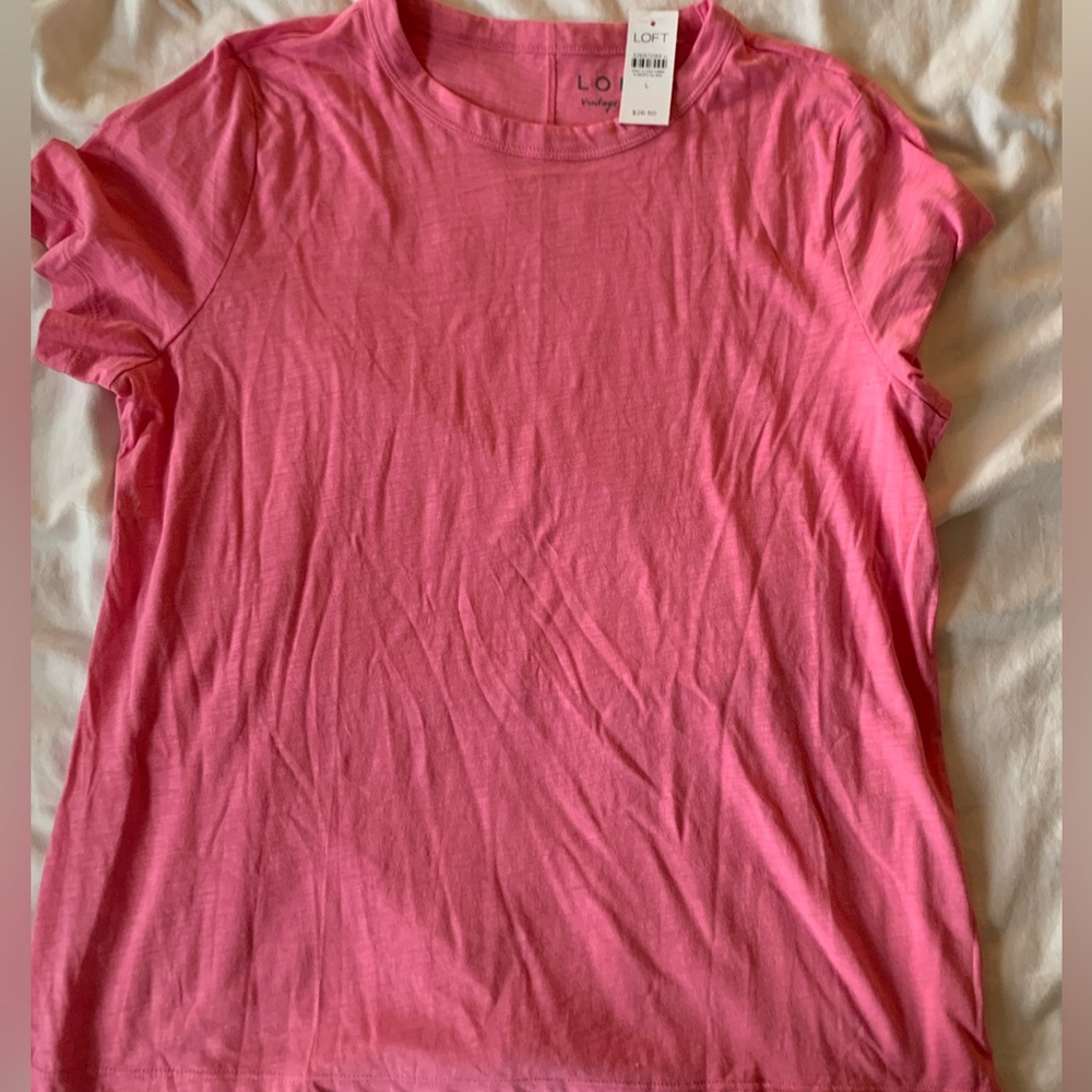 Perfect light tee. Loose fitting. Never worn, tags still attached